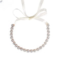 Rose gold bridal rhinestone sunflower hair band featuring delicate crystals and a soft white satin ribbon tie