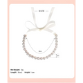 A delicate silver choker necklace with sparkling rhinestones and white satin ribbon complementing a bridal rhinestone sunflower hair band