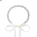 Delicate silver beaded sunflower hair band with soft white satin bow for gold bridal rhinestone styling