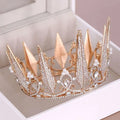 A sparkling rose gold crystal big crown wedding headdress with intricate crystal embellishments and pearl accents