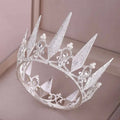 A sparkling silver crown wedding headdress with crystal big crown spikes and delicate pearl accents for weddings