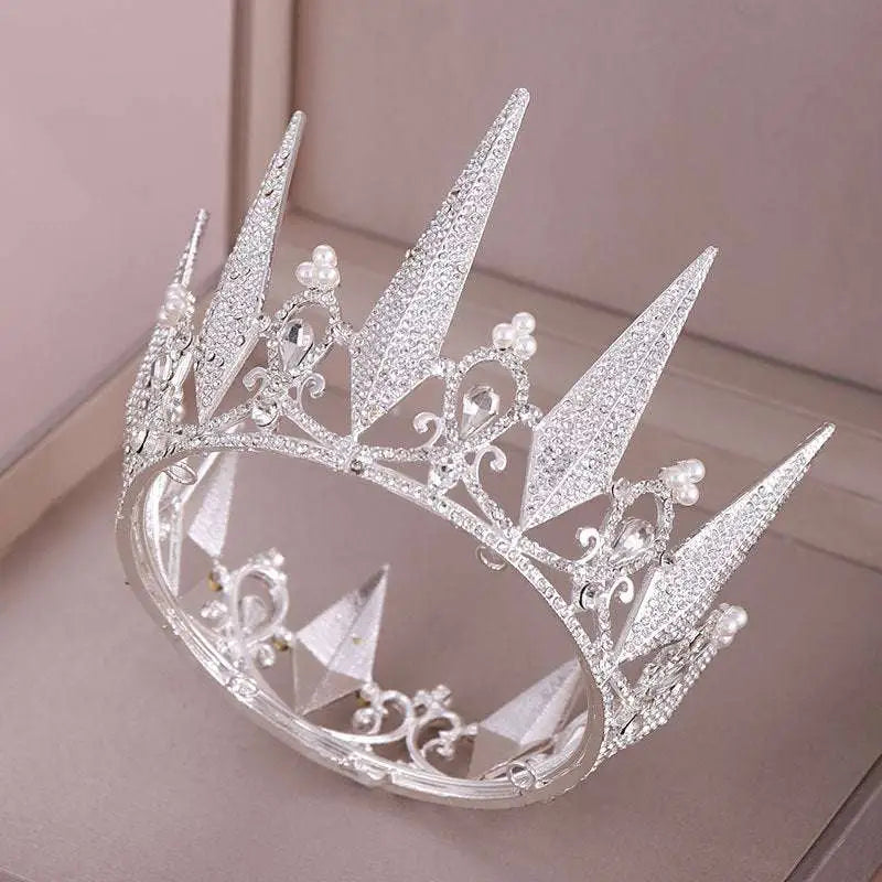 A sparkling silver crown wedding headdress with crystal big crown spikes and delicate pearl accents for weddings