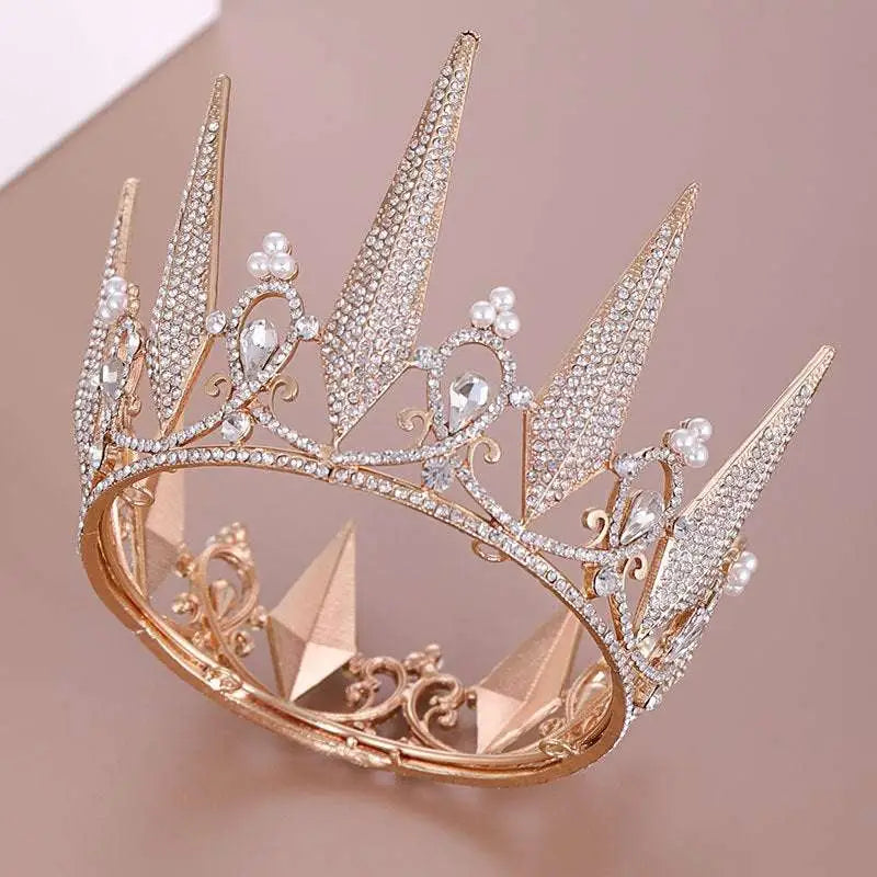 A sparkling rose gold crystal big crown wedding headdress with intricate crystal embellishments and pearl accents