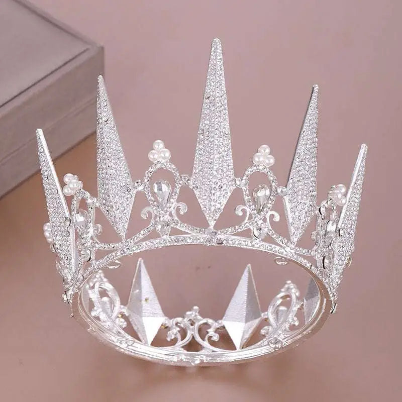 A sparkling silver crystal big crown wedding headdress with intricate crystal spikes and delicate pearl accents