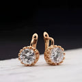 Rose gold crystal hoop earrings with round faceted stones in a beaded bezel design from classic jewelry sets