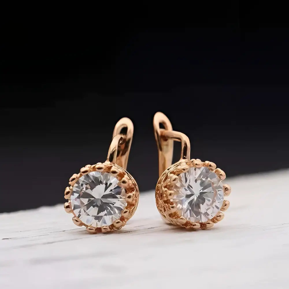 Rose gold crystal hoop earrings with round faceted stones in a beaded bezel design from classic jewelry sets
