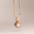 Rose gold crystal pendant necklace with a clear faceted crystal in an ornate beaded setting classic jewelry sets