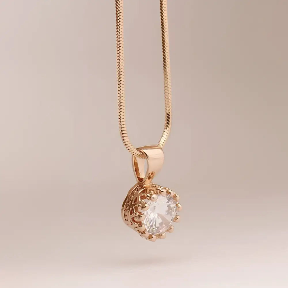 Rose gold crystal pendant necklace with a clear faceted crystal in an ornate beaded setting classic jewelry sets