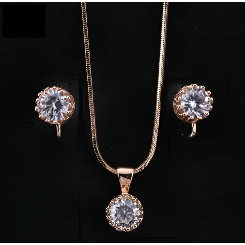 Rose gold crystal classic jewelry sets featuring a necklace with round pendant and matching stud earrings with clear stones