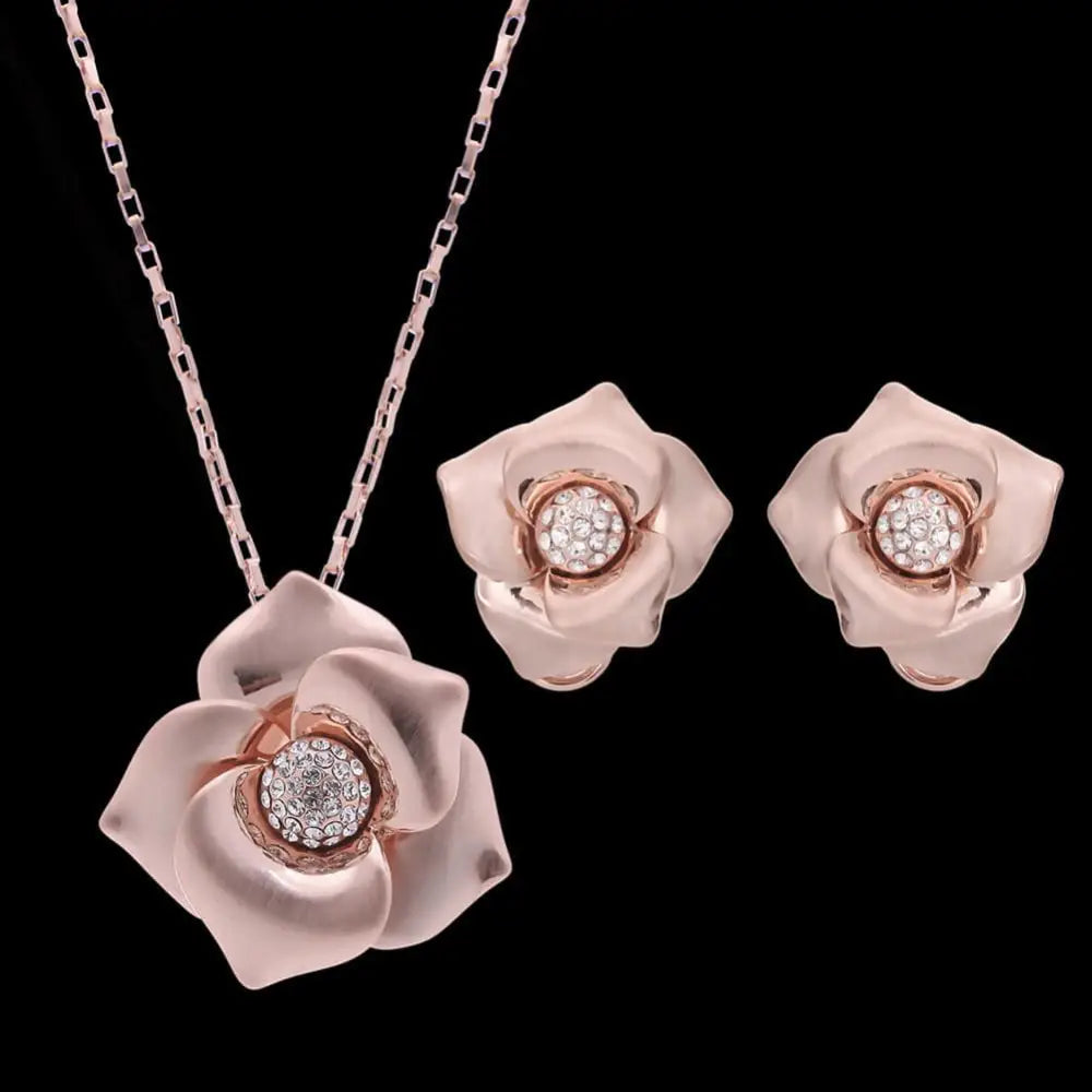 Elegant rose gold flower trade goods bride wedding jewelry set with pendant and matching earrings featuring clear stones
