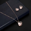 Rose gold heart pendant necklace with pink stone and diamond accents complementing pink jade earrings set