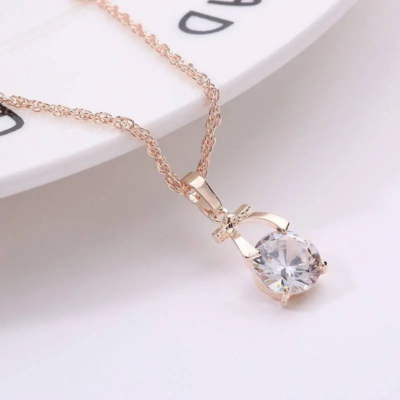 A rose gold korean version bride necklace with a delicate gold-plated butterfly pendant and clear crystal charm