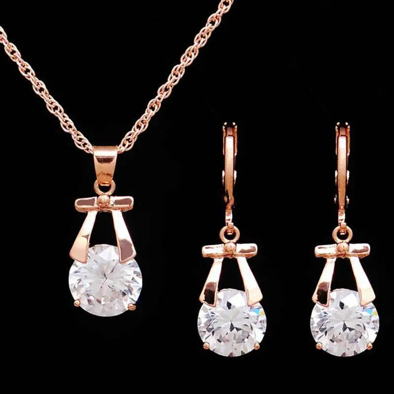 Rose gold necklace and earrings set with clear round crystals and gold-plated butterfly pendant for bride necklace fashion