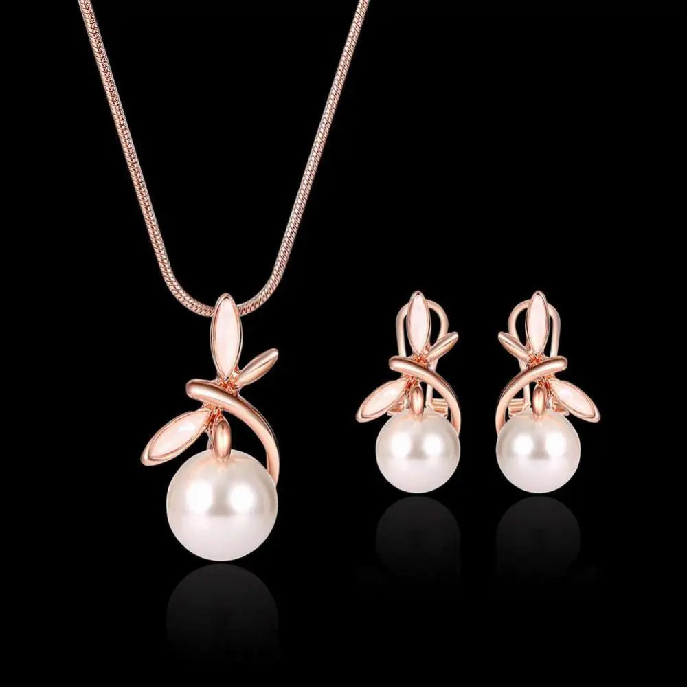 Rose gold pearl necklace earrings bridal set with delicate chain and stud earrings featuring white freshwater pearls