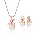 Rose gold pearl necklace earrings bridal set with delicate chain and stud earrings featuring white freshwater pearls