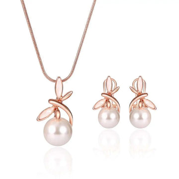 Rose gold pearl necklace earrings bridal set with delicate chain and stud earrings featuring white freshwater pearls