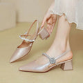 Shimmering rose gold satin pointed toe high heels with chunk chunky heel and sparkling crystal buckle mary jane style