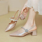 Shimmering rose gold satin pointed toe high heels with chunk chunky heel and sparkling crystal buckle mary jane style
