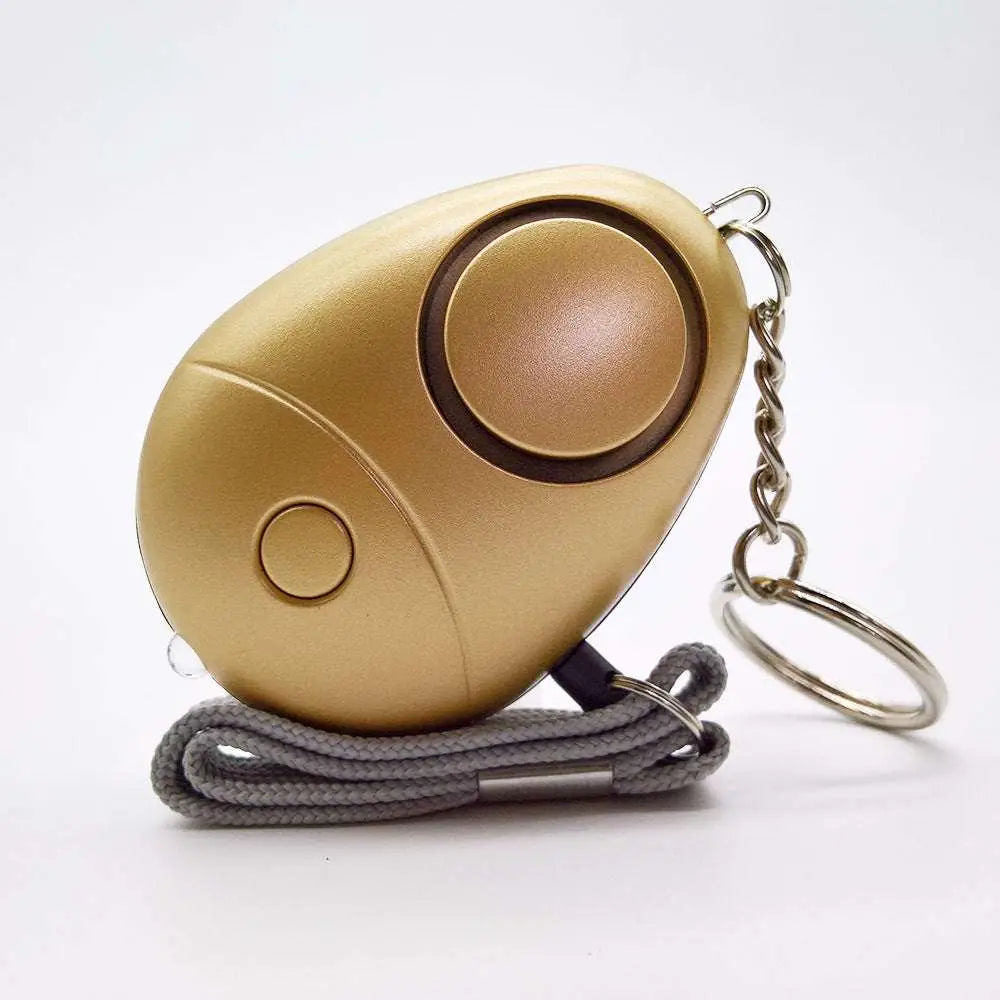 Rose gold security alarm keychain egg-shaped personal security alarm with led and gray fabric lanyard strap