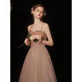 A blush pink rose gold sequin golden suspender dress female dinner gown with a sparkling beaded bodice and tulle skirt