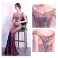 Rose gold sequined long slim fashion host gown with deep burgundy mermaid silhouette and off the shoulder neckline