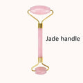 Pink rose quartz facial roller with gold-toned metal frame for gua sha wrinkle removal and skin rejuvenation