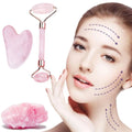 Rose quartz facial roller and gua sha wrinkle remover set with metallic handle and matching heart-shaped quartz scraper