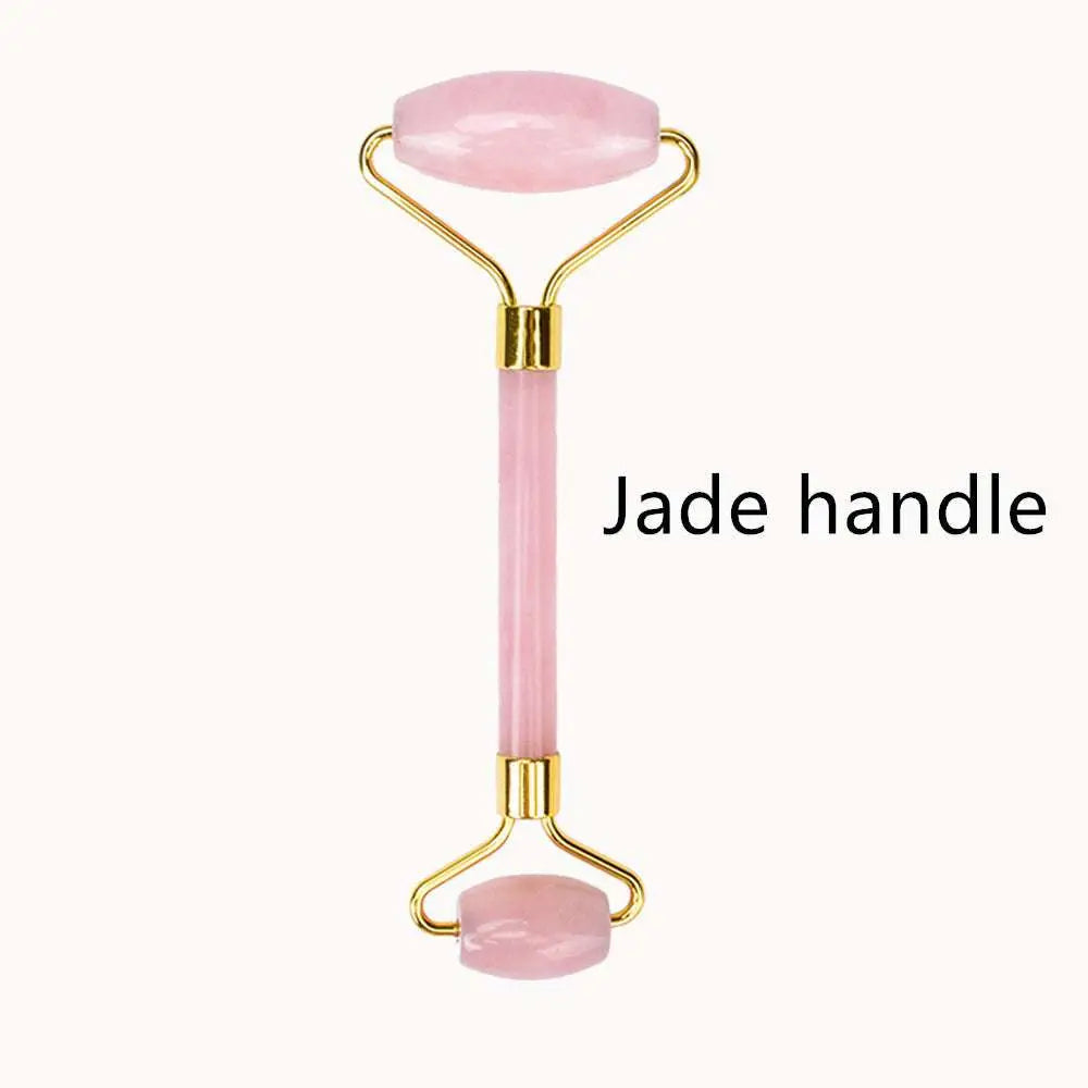 Rose quartz facial roller with gold-toned metal frame and handle for gua sha wrinkle removal and skin care