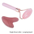 Rose quartz facial roller and gua sha wrinkle remover in pink quartz with rose gold metal frame and handle