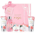 Rose spa gift set with pink rose-themed body lotion and essential oils in floral packaging with silver accents bath gift