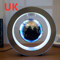 A sleek round led world map floating globe light encased in a modern frame glowing with blue led lights