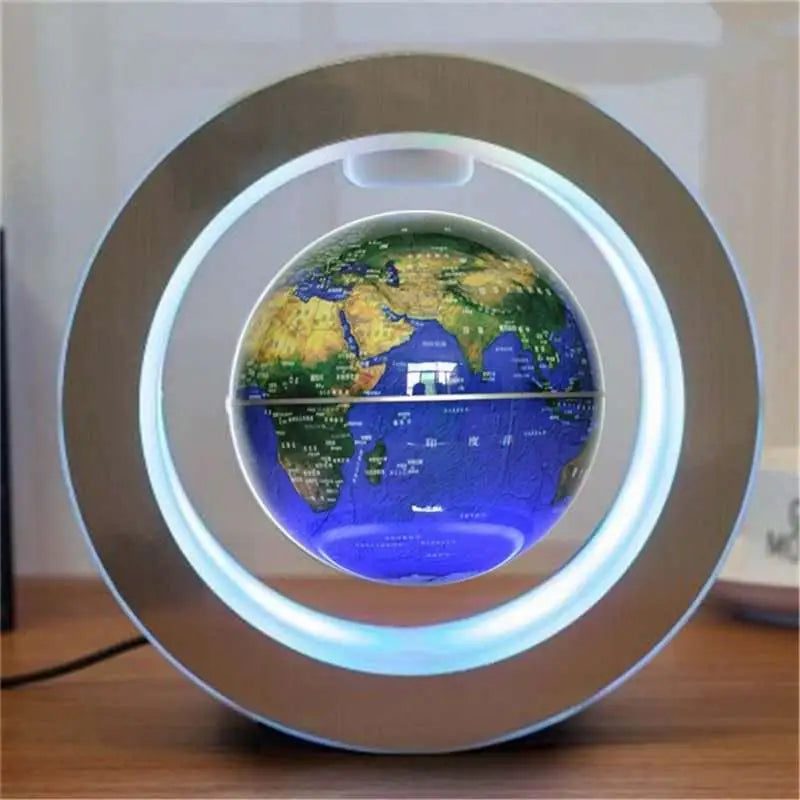 A glowing round led world map floating globe light encased in a sleek silver circular ring for elegant decor