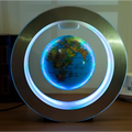 A round led world map floating globe light with blue-lit ring encased in a sleek metallic frame