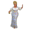 A woman wears a white and purple floral embroidery evening dress with sheer puffy sleeves and neck shirt design