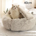 Soft fluffy gray cat bed pet with cozy plush texture and rounded shape in pink round plush faux fur design