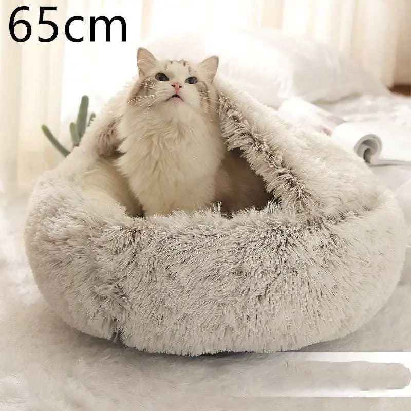 Soft fluffy beige cat bed pet with cozy faux fur texture and rounded shape in pink round plush design