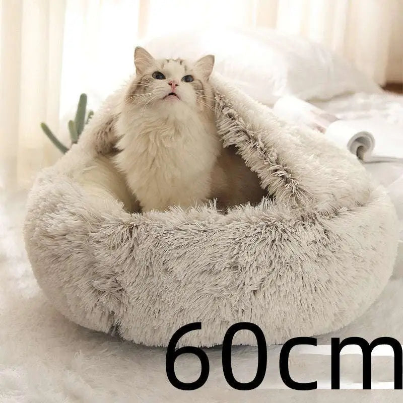 Fluffy light gray plush cat bed pet with cozy round design made of soft faux fur for warmth and comfort