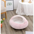 Pink round plush cat bed pet with soft faux fur exterior and cozy warm interior for comfortable resting