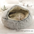 Cozy gray cat bed pet with plush crystal velvet exterior and soft beige faux fur interior in pink round plush style