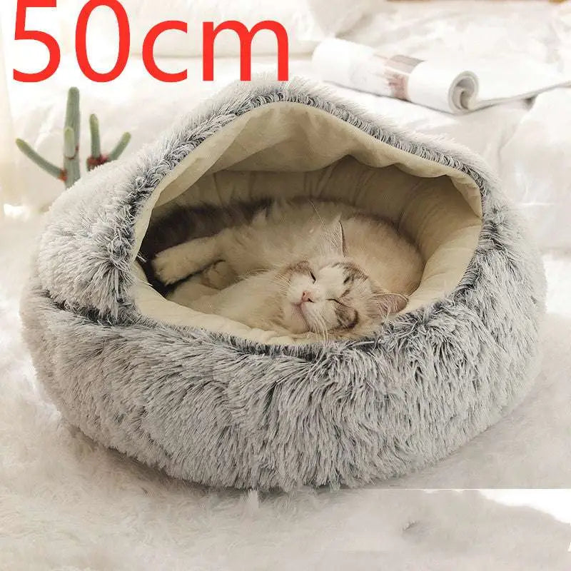 A cozy plush gray cat bed pet with soft faux fur inner lining in a pink round plush warm cat bed pet design