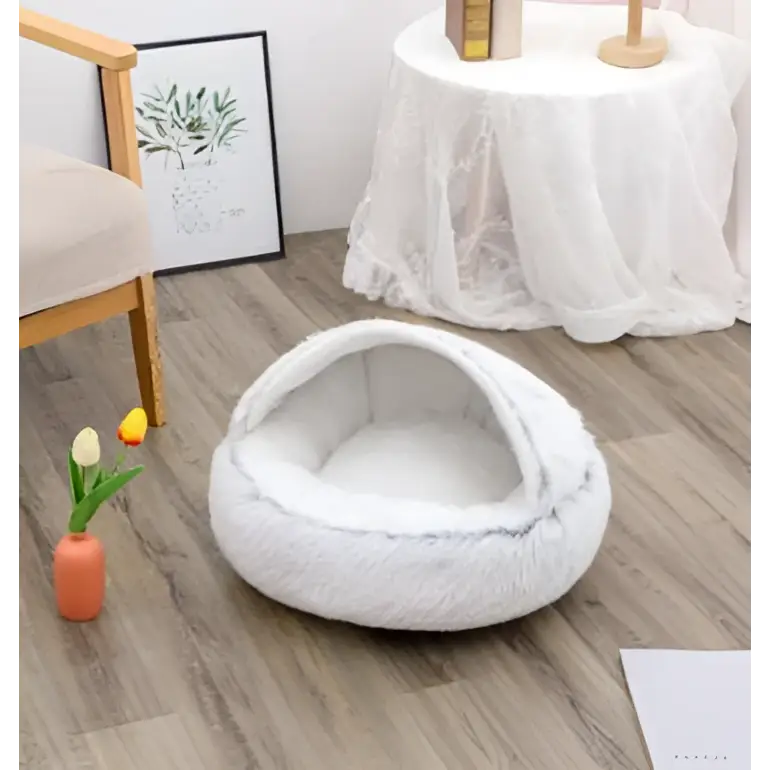 White plush cat bed pet with cozy rounded design and soft faux fur interior for warmth and comfort