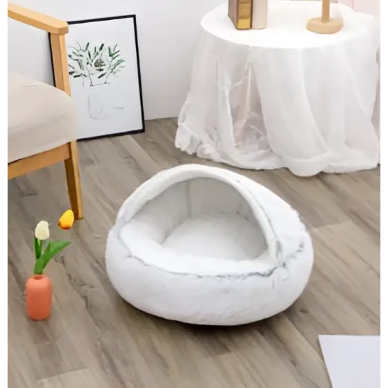 White fluffy cat bed pet with cozy rounded design made of soft faux fur pink round plush material
