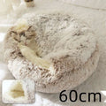 Pink round plush cat bed pet with fluffy faux fur exterior beige and white and plush inner lining for warmth and comfort