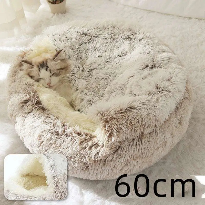 Pink round plush cat bed pet with fluffy faux fur exterior beige and white and plush inner lining for warmth and comfort