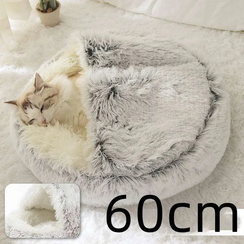 Pink round plush cat bed pet with cozy round shape and plush gray and white faux fur lining for warmth and comfort