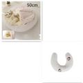Soft pink round plush cat bed pet with cream faux fur and heart-shaped embroidery for warmth and comfort