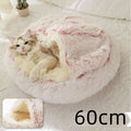 Pink round plush cat bed pet with fluffy white and pink faux fur and a cozy rounded design for warmth and comfort