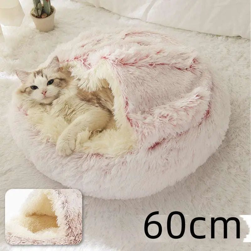 Pink round plush cat bed pet with fluffy white and pink faux fur and a cozy rounded design for warmth and comfort