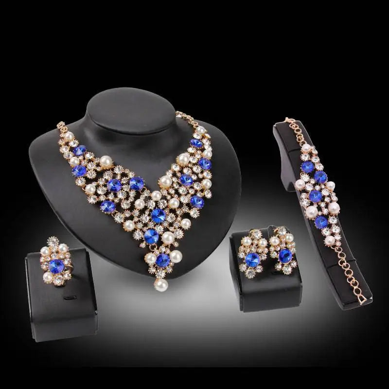 Elegant gold-toned royal blue bridal clothing accessories necklace earrings set with crystals, pearls, and rhinestones