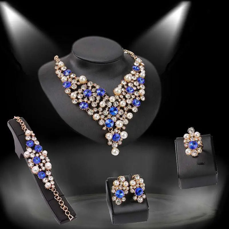 Elegant gold-toned royal blue bridal clothing accessories necklace earrings set with crystals, pearls, and rhinestones